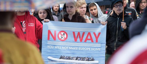 People take part at a demonstration initiated by right-wing NPD (National Democratic Party of Germany) against the German asylum law and asylum seekers in Riesa, eastern Germany, Tuesday, Aug. 18, 2015 People take part at a demonstration initiated by right-wing NPD (National Democratic Party of Germany) against the German asylum law and asylum seekers in Riesa, eastern Germany, Tuesday, Aug. 18, 2015 - Sputnik International