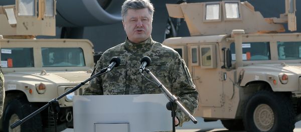 Ukraine's President Petro Poroshenko speaks during ceremony at U.S. armored Humvees in Boryspil Airport, Kiev, Ukraine, Wednesday, March 25, 2015 Ukraine's President Petro Poroshenko speaks during ceremony at U.S. armored Humvees in Boryspil Airport, Kiev, Ukraine, Wednesday, March 25, 2015 - Sputnik International