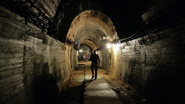 Men walk in underground galeries, part of Nazi Germany Riese construction project under the Ksiaz castle in the area where the Nazi gold train is supposedly hidden underground, on August 28, 2015 in Walbrzych, Poland. Men walk in underground galeries, part of Nazi Germany Riese construction project under the Ksiaz castle in the area where the Nazi gold train is supposedly hidden underground, on August 28, 2015 in Walbrzych, Poland. - Sputnik International
