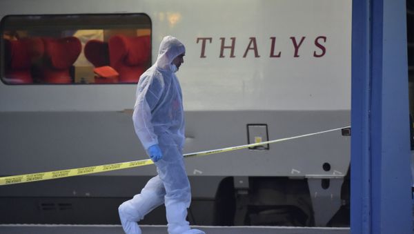 Police walk on a platform next to a Thalys train of French national railway operator SNCF at the main train station in Arras, northern France, on August 21, 2015 Police walk on a platform next to a Thalys train of French national railway operator SNCF at the main train station in Arras, northern France, on August 21, 2015 - Sputnik International