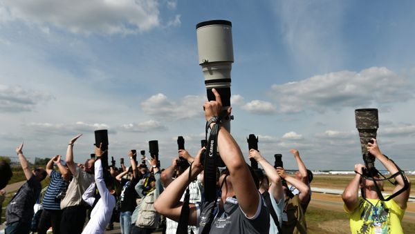 Photo correspondents at the MAKS 2015 International Aviation and Space Salon in Zhukovsky outside Moscow. - Sputnik International