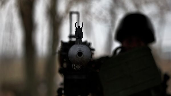 A soldier mans a heavy machine-gun position at a Ukrainian army checkpoint near Kurakhove, Ukraine (File) - Sputnik International