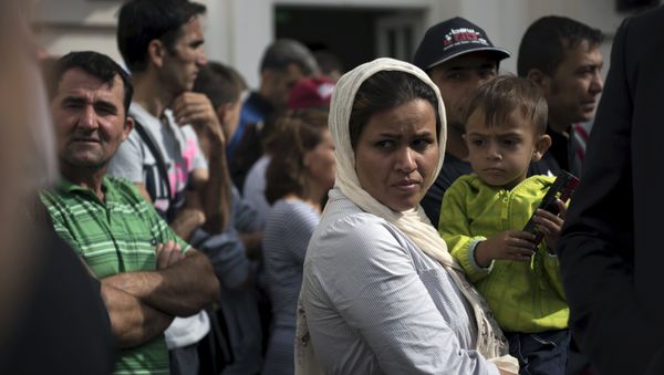Migrants wait for the visit of German President Joachim Gauck in an asylum seekers accommodation facility in Berlin, Germany, August 26, 2015. Migrants wait for the visit of German President Joachim Gauck in an asylum seekers accommodation facility in Berlin, Germany, August 26, 2015. - Sputnik International