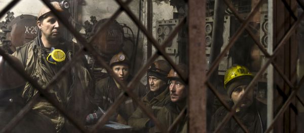 Ukrainian coal miners wait in a room before going underground at the Zasyadko mine in Donetsk, Ukraine Ukrainian coal miners wait in a room before going underground at the Zasyadko mine in Donetsk, Ukraine - Sputnik International