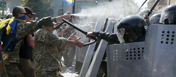 Demonstrators, who are against a constitutional amendment on decentralization, clash with police outside the parliament building in Kiev Demonstrators, who are against a constitutional amendment on decentralization, clash with police outside the parliament building in Kiev - Sputnik International