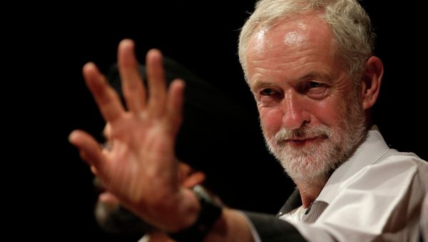 British lawmaker Jeremy Corbyn waves to a member of the audience prior to addressing a meeting during his election campaign for the leadership of the British Labour Party in Ealing, west London, Monday, Aug. 17, 2015. - Sputnik International