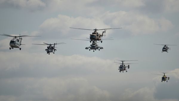 The Russia's Helicopters aerobatic team performs at the MAKS 2015 International Aviation and Space Salon in Zhukovsky outside Moscow. The Russia's Helicopters aerobatic team performs at the MAKS 2015 International Aviation and Space Salon in Zhukovsky outside Moscow. - Sputnik International
