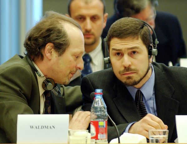 Maher Arar, right, confers with one of his lawyers moments before he addresses the European Parliament Committee. Maher Arar, right, confers with one of his lawyers moments before he addresses the European Parliament Committee. - Sputnik International