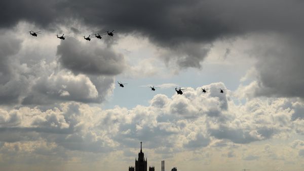 Mi 28 helicopters, military transport helicopter Mi 26, third from right, and MI 8 helicopters during a full dress rehearsal of the V-Day Parade on Red Square, Moscow. - Sputnik International