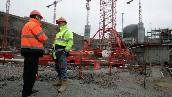 Workers are seen on a construction site of France's first new generation nuclear reactor in Flamanville, northwestern France, Friday, Feb. 6, 2009. The new so-called European Pressurized Reactors (EPR) plant on the Normandy coast, will be operational in 2012. - Sputnik International