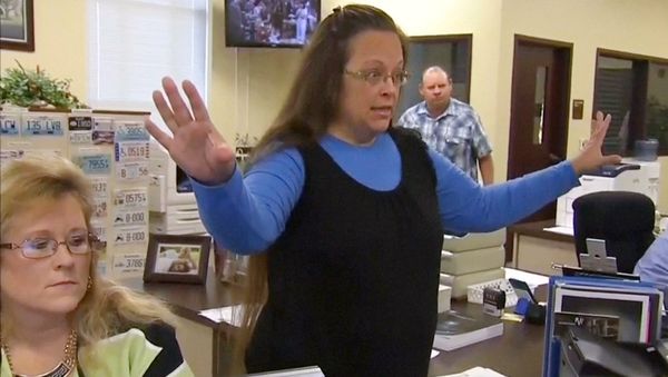 Rowan County Clerk Kim Davis gestures as she refuses to issue marriage licenses to a same-sex couple in Morehead, Kentucky September 1, 2015, in a still image from video provided by WLEX Rowan County Clerk Kim Davis gestures as she refuses to issue marriage licenses to a same-sex couple in Morehead, Kentucky September 1, 2015, in a still image from video provided by WLEX - Sputnik International
