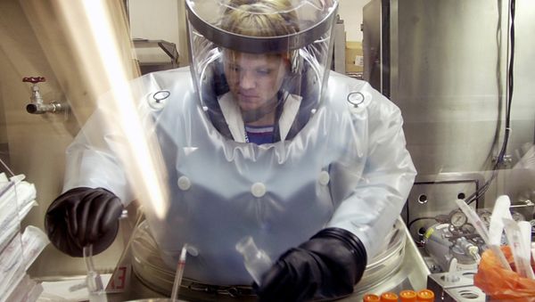 FILE - In this May 11, 2003, file photo, Microbiologist Ruth Bryan works with BG nerve agent simulant in Class III Glove Box in the Life Sciences Test Facility at Dugway Proving Ground, Utah. The specialized airtight enclosure is also used for hands-on work with anthrax and other deadly agents - Sputnik International