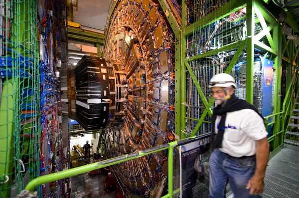 A worker walks past the CERN's Compact Muon Solenoid (CMS), a general-purpose detector at the Large Hadron Collider (LHC), during maintenance works A worker walks past the CERN's Compact Muon Solenoid (CMS), a general-purpose detector at the Large Hadron Collider (LHC), during maintenance works - Sputnik International