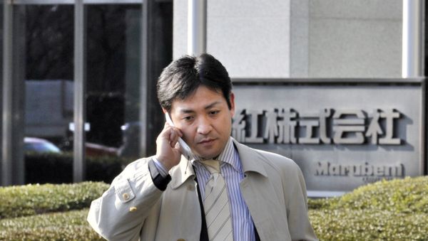 A Japanese businessman walks in front of Japanese trading company Marubeni in Tokyo A Japanese businessman walks in front of Japanese trading company Marubeni in Tokyo - Sputnik International
