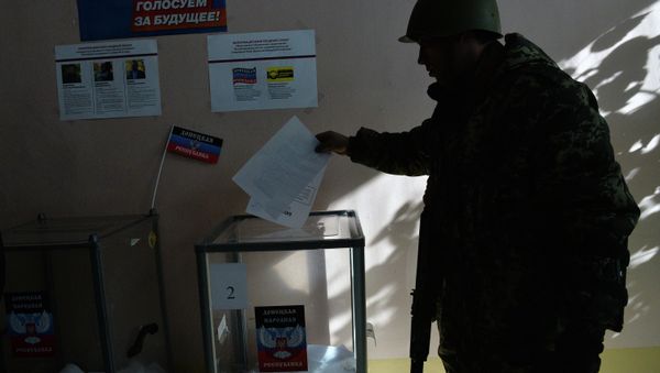 Members of the self-defense forces cast their votes at Polling Station No. 127 during the elections for the leader and the People's Council of the Donetsk People's Republic. Members of the self-defense forces cast their votes at Polling Station No. 127 during the elections for the leader and the People's Council of the Donetsk People's Republic. - Sputnik International