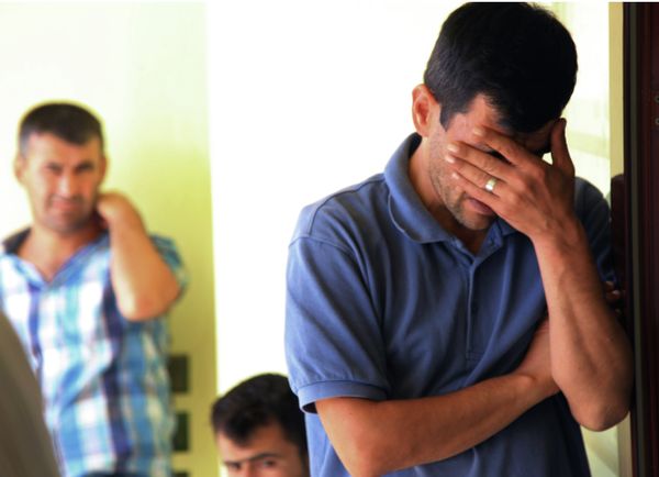 Abdullah Kurdi, 40, father of Syrian boys Aylan, 3, and Galip, 5, who were washed up drowned on a beach near Turkish resort of Bodrum on Wednesday, cries as he waits for the delivery of their bodies outside a morgue in Mugla, Turkey, Thursday, Sept. 3, 2015 - Sputnik International