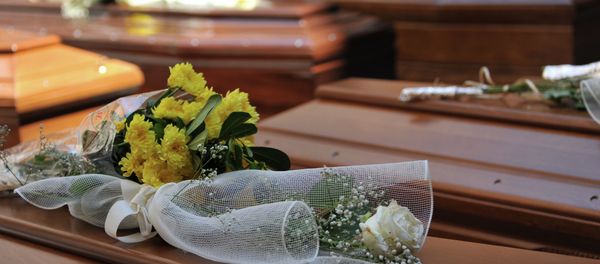 Flowers lay on top of coffins with the remains of 13 migrants who were among up to 800 people who died in a shipwreck in April, in Catania, Sicily, Italy, Tuesday, July 7, 2015 Flowers lay on top of coffins with the remains of 13 migrants who were among up to 800 people who died in a shipwreck in April, in Catania, Sicily, Italy, Tuesday, July 7, 2015 - Sputnik International