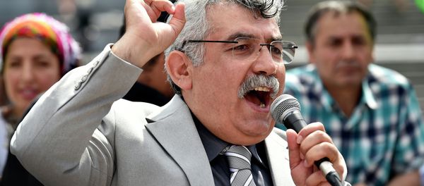 Zubeyir Aydar, president of the People's Congress of Kurdistan, addresses Kurdish protesters during a demonstration against alleged attacks perpetrated by the Turkish army against Kurds, in Brussels on August 8, 2015 Zubeyir Aydar, president of the People's Congress of Kurdistan, addresses Kurdish protesters during a demonstration against alleged attacks perpetrated by the Turkish army against Kurds, in Brussels on August 8, 2015 - Sputnik International