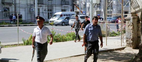 Police officers secure an area in the capital of Tajikistan, Dushanbe, where several Interior Ministry special forces officers and a traffic policeman were reportedly shot dead earlier on Friday, Sept. 4, 2015 Police officers secure an area in the capital of Tajikistan, Dushanbe, where several Interior Ministry special forces officers and a traffic policeman were reportedly shot dead earlier on Friday, Sept. 4, 2015 - Sputnik International