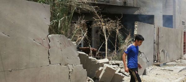 Abdullah Ahmed walks outside his home that was damaged in a bombing in Fallujah, Iraq. The U.S. and its coalition allies have carried out more than 1,000 strikes in Iraq since its campaign began in August - as well as hundreds more by American and Arab air forces in neighboring Syria. Abdullah Ahmed walks outside his home that was damaged in a bombing in Fallujah, Iraq. The U.S. and its coalition allies have carried out more than 1,000 strikes in Iraq since its campaign began in August - as well as hundreds more by American and Arab air forces in neighboring Syria. - Sputnik International