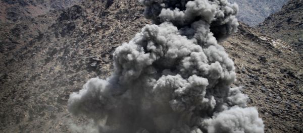 Smoke rises after a coalition air strike against a building believed occupied by Taliban fighters in Kuz Kunar, Nangarhar province east of Kabul. Smoke rises after a coalition air strike against a building believed occupied by Taliban fighters in Kuz Kunar, Nangarhar province east of Kabul. - Sputnik International