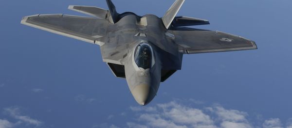 A F-22 Raptor fighter jet of the 95th Fighter Squadron from Tyndall, Florida approaches a KC-135 Stratotanker from the 100th Air Refueling Wing at the Royal Air Force Base in Mildenhall in Britain as they fly over the Baltic Sea towards the newly established NATO airbase of Aemari, Estonia September 4, 2015. - Sputnik International