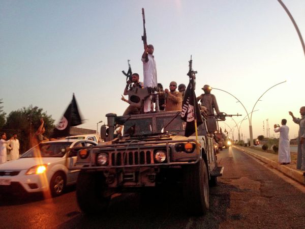 FILE - In this photo taken Monday, June 23, 2014, fighters from the Islamic State group parade in a commandeered Iraqi security forces armored vehicle down a main road at the northern city of Mosul, Iraq FILE - In this photo taken Monday, June 23, 2014, fighters from the Islamic State group parade in a commandeered Iraqi security forces armored vehicle down a main road at the northern city of Mosul, Iraq - Sputnik International