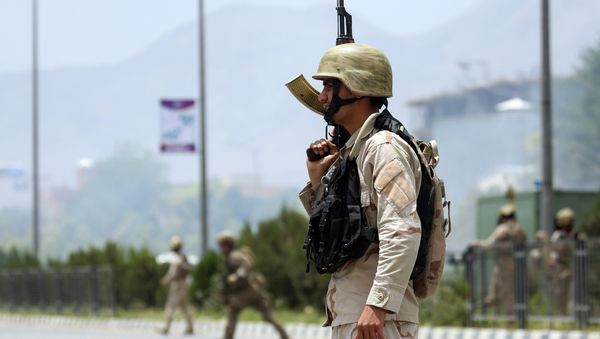 Afghan security forces gather at the site of an attack by Taliban fighters outside the parliament in Kabul, Afghanistan, Monday, June 22, 2015 Afghan security forces gather at the site of an attack by Taliban fighters outside the parliament in Kabul, Afghanistan, Monday, June 22, 2015 - Sputnik International