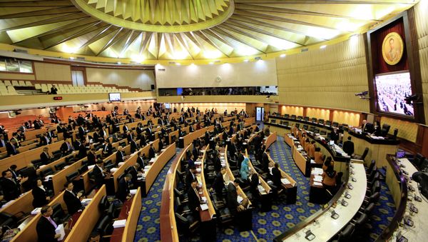 Thailand's legislature, known as the National Reform Council, stands after they votee 135 against vs. 105 in favor with seven abstentions on the new draft constitution Sunday, Sept. 6, 2015, in Bangkok, Thailand Thailand's legislature, known as the National Reform Council, stands after they votee 135 against vs. 105 in favor with seven abstentions on the new draft constitution Sunday, Sept. 6, 2015, in Bangkok, Thailand - Sputnik International