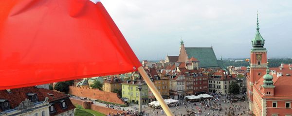 A Polish national flag waves above the Zamkowy Square as people stop to commemorate the 70th anniversary of the 1944 Warsaw Uprising, in Warsaw, Poland, Friday, Aug. 1, 2014 A Polish national flag waves above the Zamkowy Square as people stop to commemorate the 70th anniversary of the 1944 Warsaw Uprising, in Warsaw, Poland, Friday, Aug. 1, 2014 - Sputnik International