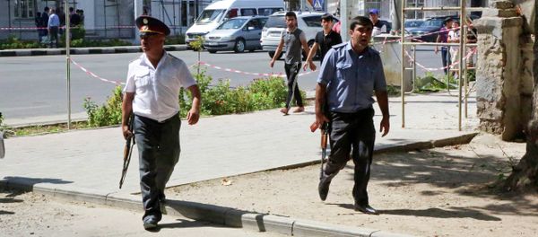 Police officers secure an area in the capital of Tajikistan, Dushanbe, where several Interior Ministry special forces officers and a traffic policeman were reportedly shot dead earlier on Friday, Sept. 4, 2015 Police officers secure an area in the capital of Tajikistan, Dushanbe, where several Interior Ministry special forces officers and a traffic policeman were reportedly shot dead earlier on Friday, Sept. 4, 2015 - Sputnik International