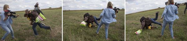 A Hungarian TV camerawoman trips a migrant carrying a child while trying to escape from a collection point in Roszke village, Hungary. - Sputnik International