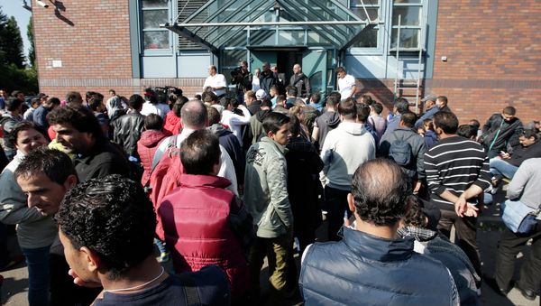 People wait outside a registration center for migrants and refugees in Berlin, Germany, Thursday, Sept. 10, 2015. People wait outside a registration center for migrants and refugees in Berlin, Germany, Thursday, Sept. 10, 2015. - Sputnik International