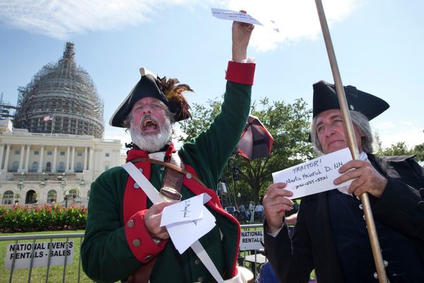 Rally attendees hold up names and phone numbers of legislators who are in support of the Iran deal. Rally attendees hold up names and phone numbers of legislators who are in support of the Iran deal. - Sputnik International