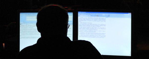 Unidentifiable man on a computer Unidentifiable man on a computer - Sputnik International