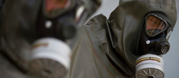 Employees in protective gear are seen during a demonstration in a chemical weapons disposal facility at GEKA (Gesellschaft zur Entsorgung von chemischen Kampfstoffen und Ruestungsaltlasten) in Munster, northern Germany, on October 30, 2013 Employees in protective gear are seen during a demonstration in a chemical weapons disposal facility at GEKA (Gesellschaft zur Entsorgung von chemischen Kampfstoffen und Ruestungsaltlasten) in Munster, northern Germany, on October 30, 2013 - Sputnik International