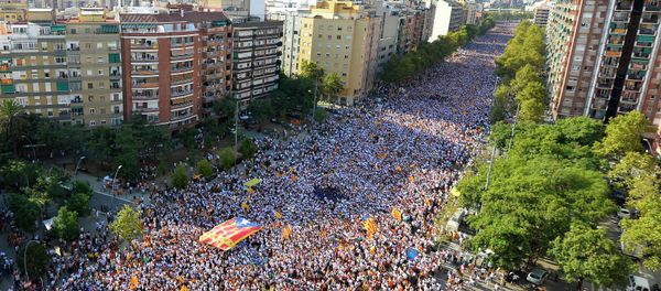 Demonstrators gather on Meridiana street as they wave Estelada flags (pro-independence Catalan flags) during celebrations of Catalonia's National Day (Diada) which recalls the final defeat of local troops by Spanish king Philip V's forces in 1714, in Barcelona on September 11, 2015 Demonstrators gather on Meridiana street as they wave Estelada flags (pro-independence Catalan flags) during celebrations of Catalonia's National Day (Diada) which recalls the final defeat of local troops by Spanish king Philip V's forces in 1714, in Barcelona on September 11, 2015 - Sputnik International