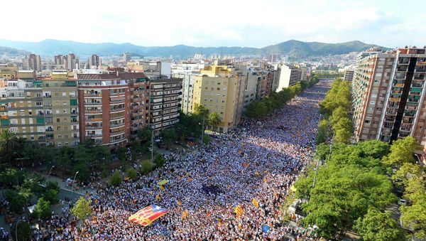 Demonstrators gather on Meridiana street as they wave Estelada flags (pro-independence Catalan flags) during celebrations of Catalonia's National Day (Diada) which recalls the final defeat of local troops by Spanish king Philip V's forces in 1714, in Barcelona on September 11, 2015 Demonstrators gather on Meridiana street as they wave Estelada flags (pro-independence Catalan flags) during celebrations of Catalonia's National Day (Diada) which recalls the final defeat of local troops by Spanish king Philip V's forces in 1714, in Barcelona on September 11, 2015 - Sputnik International