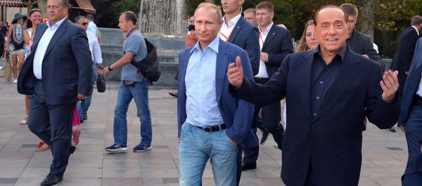 Russian President Vladimir Putin (3rd R) and Italy's former prime minister Silvio Berlusconi (R) walk along the Yalta embankment in Crimea on September 11, 2015 - Sputnik International