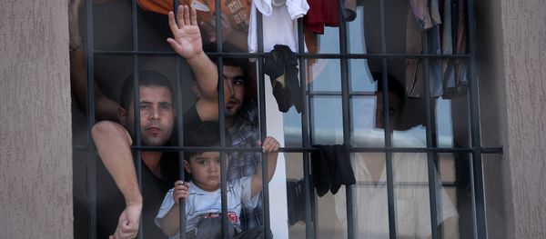 Refugees behind a barred window at Bulgaria's shelter for clandestine migrants near Lyubimets, as the small EU state finds it hard to cope with an ever rising number of Syrians fleeing conflict at home Refugees behind a barred window at Bulgaria's shelter for clandestine migrants near Lyubimets, as the small EU state finds it hard to cope with an ever rising number of Syrians fleeing conflict at home - Sputnik International