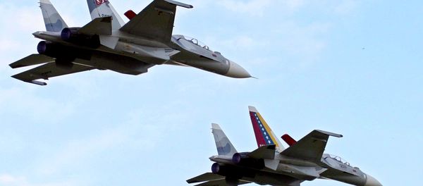 File photo of Venezuela's two Sukhoi fighter jets fly during the anniversary celebration of Venezuela's Air Force in Maracay, Venezuela, Sunday, Dec. 10, 2006 File photo of Venezuela's two Sukhoi fighter jets fly during the anniversary celebration of Venezuela's Air Force in Maracay, Venezuela, Sunday, Dec. 10, 2006 - Sputnik International