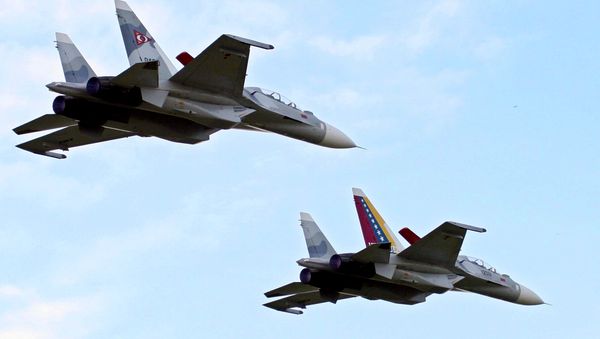 File photo of Venezuela's two Sukhoi fighter jets fly during the anniversary celebration of Venezuela's Air Force in Maracay, Venezuela, Sunday, Dec. 10, 2006 - Sputnik International