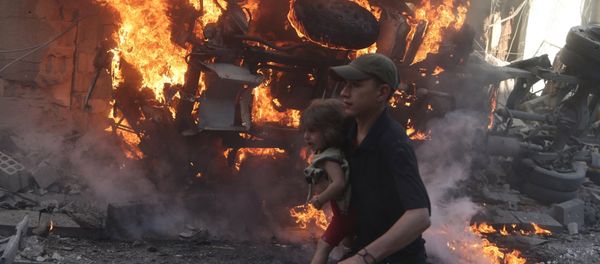 A girl is evacuated from a site, which was hit by what activists said were airstrikes by forces loyal to Syria's President Bashar al-Assad, in the Douma neighborhood of Damascus, Syria August 24, 2015 A girl is evacuated from a site, which was hit by what activists said were airstrikes by forces loyal to Syria's President Bashar al-Assad, in the Douma neighborhood of Damascus, Syria August 24, 2015 - Sputnik International