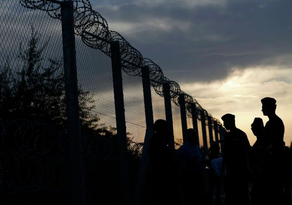Hungarian policemen guard the fence on the border with Serbia near the Hungarian migrant collection point in Roszke, Hungary, September 14, 2015 Hungarian policemen guard the fence on the border with Serbia near the Hungarian migrant collection point in Roszke, Hungary, September 14, 2015 - Sputnik International