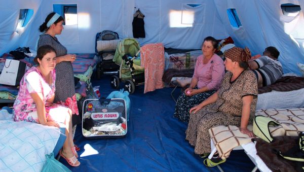 Women in a tent camp for refugees from Donbass Women in a tent camp for refugees from Donbass - Sputnik International