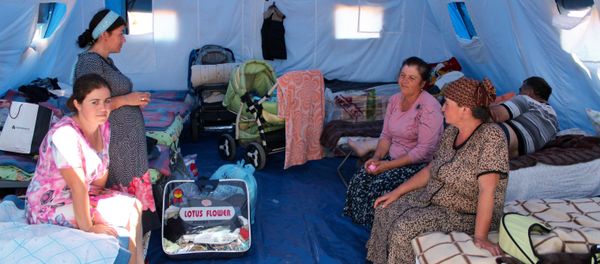 Women in a tent camp for refugees from Donbass Women in a tent camp for refugees from Donbass - Sputnik International