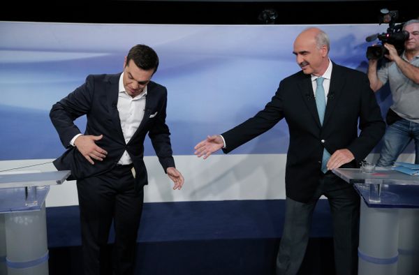 Former Greek Prime Minister Alexis Tsipras, left, and the leader of the left-wing Syriza party, is blocked by microphone wiring as he tries to approach main opposition conservative New Democracy head Vangelis Meimarakis, right, to shake hands prior to a live televised debate at the state-run ERT television in Athens, Monday, Sept. 14, 2015. Greece is holding a snap general election on Sept. 20, 2015. Former Greek Prime Minister Alexis Tsipras, left, and the leader of the left-wing Syriza party, is blocked by microphone wiring as he tries to approach main opposition conservative New Democracy head Vangelis Meimarakis, right, to shake hands prior to a live televised debate at the state-run ERT television in Athens, Monday, Sept. 14, 2015. Greece is holding a snap general election on Sept. 20, 2015. - Sputnik International