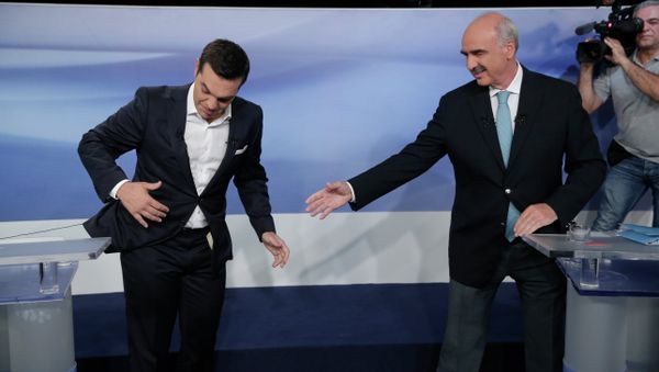 Former Greek Prime Minister Alexis Tsipras, left, and the leader of the left-wing Syriza party, is blocked by microphone wiring as he tries to approach main opposition conservative New Democracy head Vangelis Meimarakis, right, to shake hands prior to a live televised debate at the state-run ERT television in Athens, Monday, Sept. 14, 2015. Greece is holding a snap general election on Sept. 20, 2015. - Sputnik International