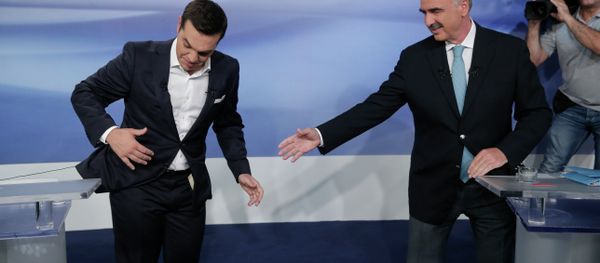 Former Greek Prime Minister Alexis Tsipras, left, and the leader of the left-wing Syriza party, is blocked by microphone wiring as he tries to approach main opposition conservative New Democracy head Vangelis Meimarakis, right, to shake hands prior to a live televised debate at the state-run ERT television in Athens, Monday, Sept. 14, 2015. Greece is holding a snap general election on Sept. 20, 2015. Former Greek Prime Minister Alexis Tsipras, left, and the leader of the left-wing Syriza party, is blocked by microphone wiring as he tries to approach main opposition conservative New Democracy head Vangelis Meimarakis, right, to shake hands prior to a live televised debate at the state-run ERT television in Athens, Monday, Sept. 14, 2015. Greece is holding a snap general election on Sept. 20, 2015. - Sputnik International