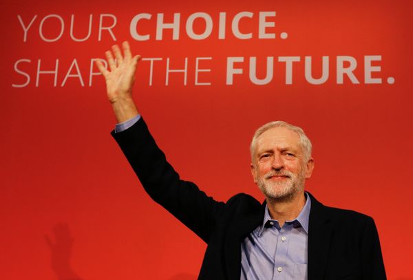 Jeremy Corbyn waves on stage after new is announced as the new leader of The Labour Party during the Labour Party Leadership Conference in London. - Sputnik International
